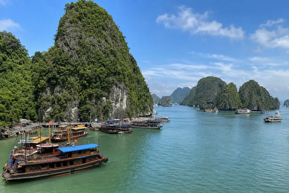 Ha Long Bay limestone karsts and wooden boats